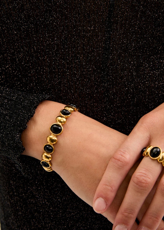 BRACCIALE RIGIDO CON PIETRE ORO\NERO